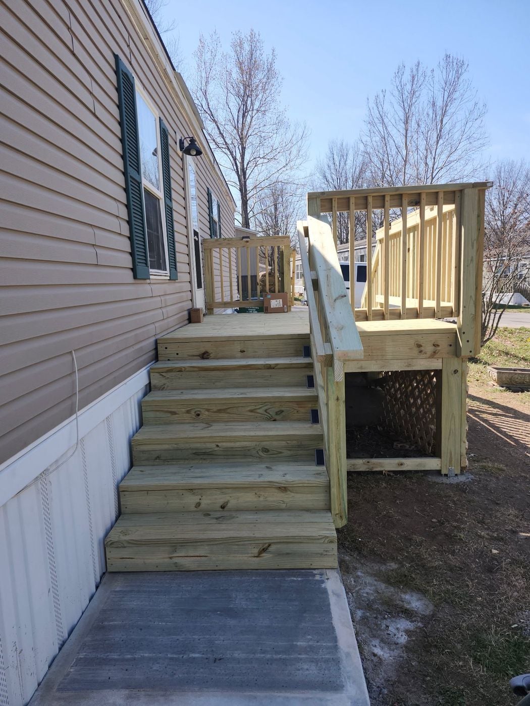 New pressure-treated landing and steps in Belton, MO