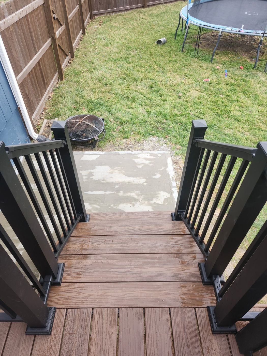 Composite deck stairs with black rails in Peculiar, MO