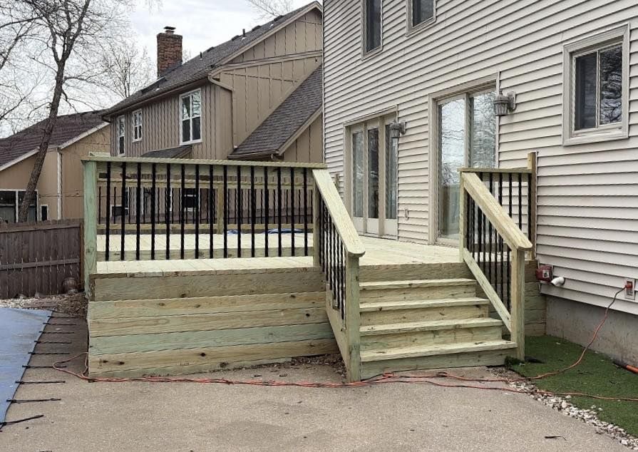 New pressure-treated deck with black rails